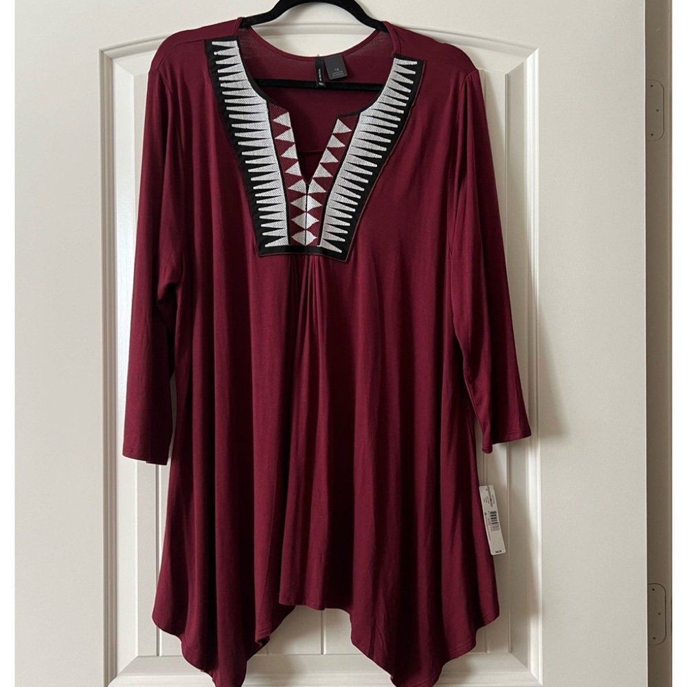 Burgundy tunic. Top is soft with gold black and white detailing at neck